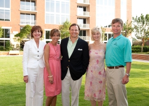 From left, Atlanta Fine Homes Sotheby's International Realty agents Kay Quigley, Suzanne Dils and Sam Bayne and Anne Schwall, senior vice president of the firm's Skyrise Group, and her husband Craig on The Brookwood's great lawn.